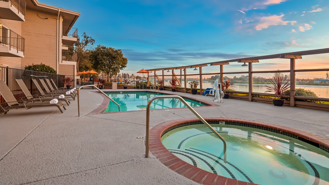 A Beautiful View of the Heated Pool and Jacuzzi at Executive Inn & Suites and Best Western Plus Bayside Hotel